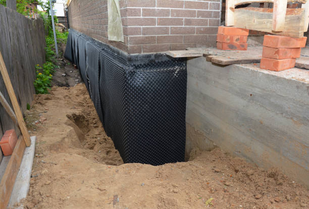 Happy homeowners after waterproofing job in Medina